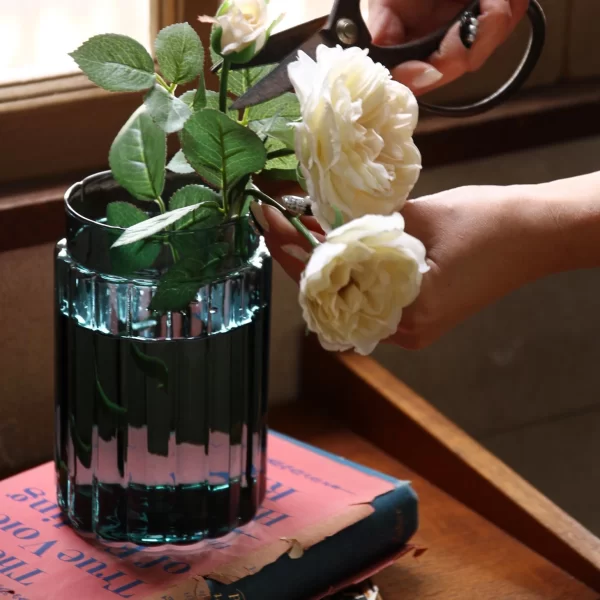 teal green vase with ribbed design